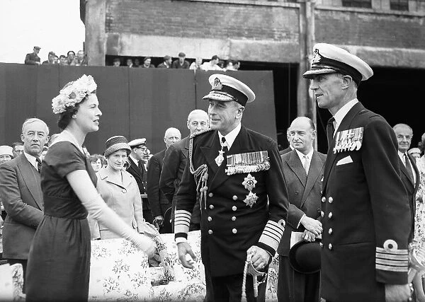 Earl Mountbatten, Admiral of the Fleet, meets the wife of J E Scotland the Captain HMS