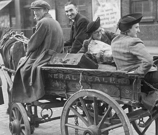 An East End family leaving the city with their belongings on the back of a horse