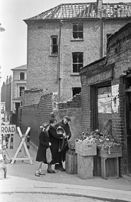 Framed Print : East End greengrocer doing his best to remain open for his customers despite