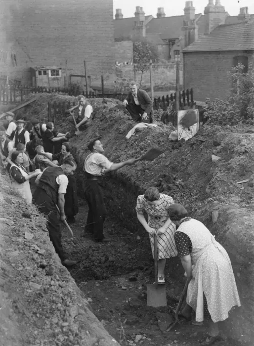 Framed Print : Eastenders seen here digging a trench for a communal air raid shelter in their back Framed Print : Eastenders seen here digging a trench for a communal air raid shelter in their back