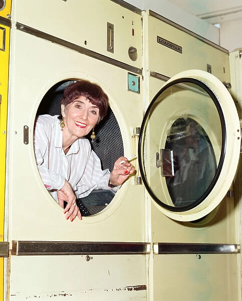 EastEnders star June Brown in a launderette. 6th February 1997