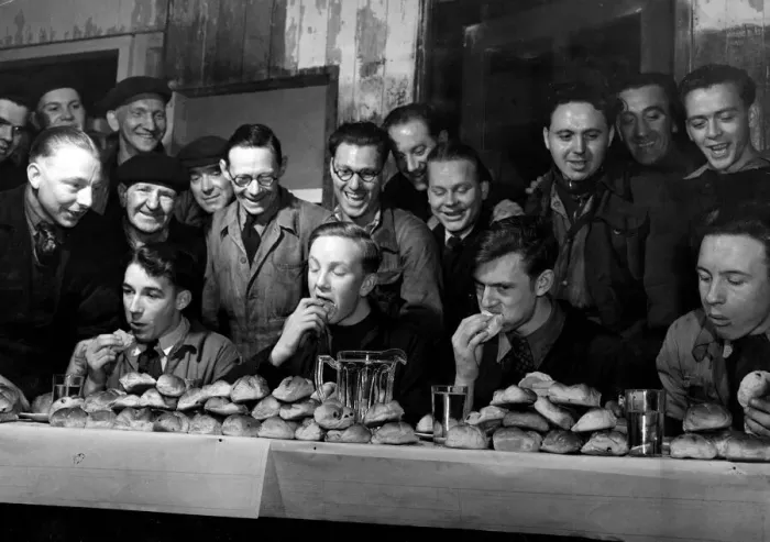 Framed Print : Easter 1951 Four contestants in the annual hot cross bun eating competition Framed Print : Easter 1951 Four contestants in the annual hot cross bun eating competition