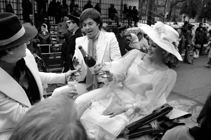 Framed Print : The Easter parade, Battersea Park. Film star Carol Baker gets a drink of champagne before