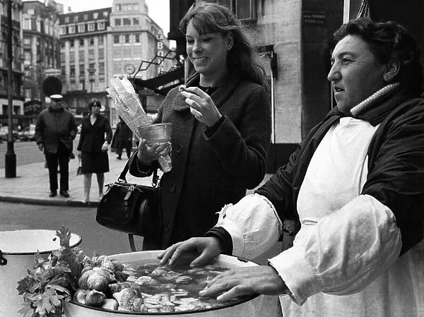 Eating snails in the street in Brussles. Madame Jean Piarre Bouffouix