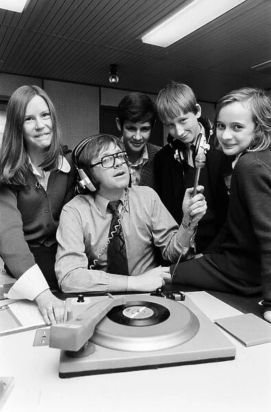 Ed Doolan BRMB Radio Disc Jockey, pictured with news boys and girls, Birmingham
