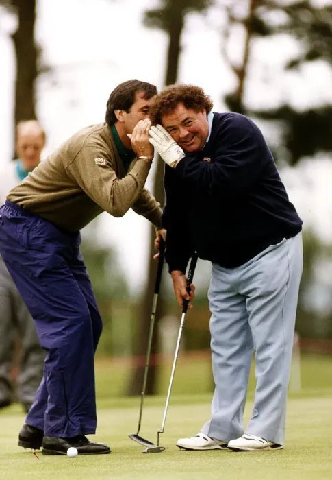 Framed Print : Eddie Little Comedian listens as Sevvy Ballesteros Golf whispers in his ear at a Pro Framed Print : Eddie Little Comedian listens as Sevvy Ballesteros Golf whispers in his ear at a Pro
