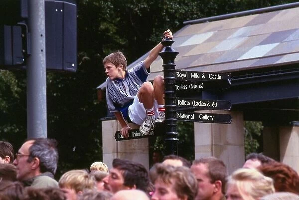 Edinburgh Festival August 1989 Boy on top of sign post