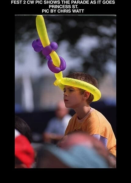 Edinburgh festival parade august 1997 Small boy with hat made of balloons animal shapes