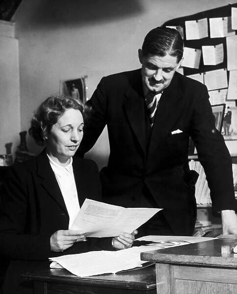 Edith Pitt, Conservative MP looks over the papers and agenda for a meeting with