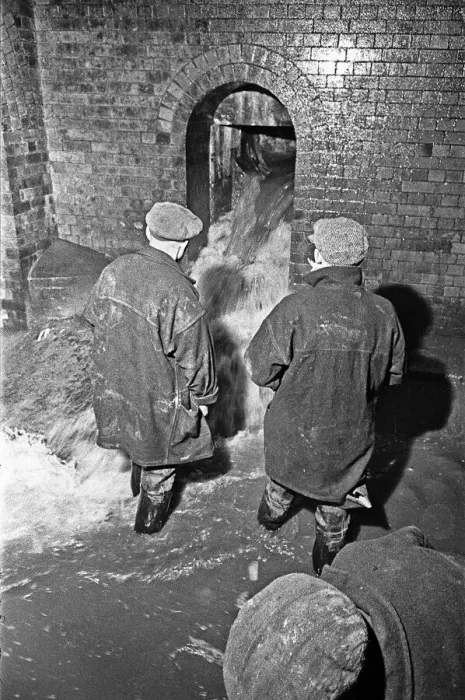 Framed Print : Edward Farmer and his gang seen here going underground cleaning scraps of paper Framed Print : Edward Farmer and his gang seen here going underground cleaning scraps of paper