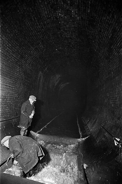 Edward Farmer and his gang seen here underground cleaning scraps of paper