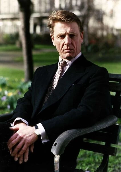 Edward Fox actor sitting on a park bench - September 1989