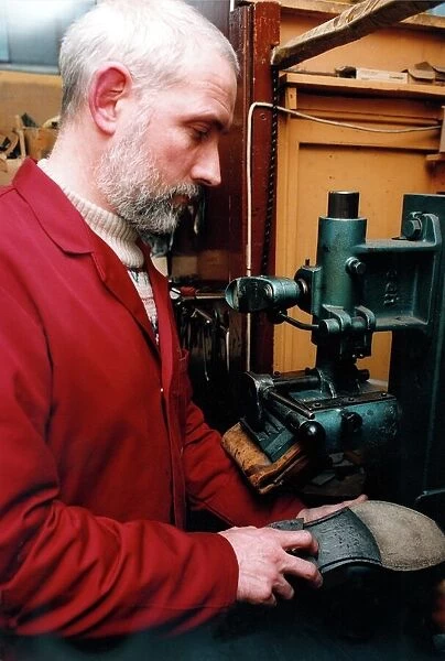Edwin Macklow, second generation cobbler at work in his fathers shop