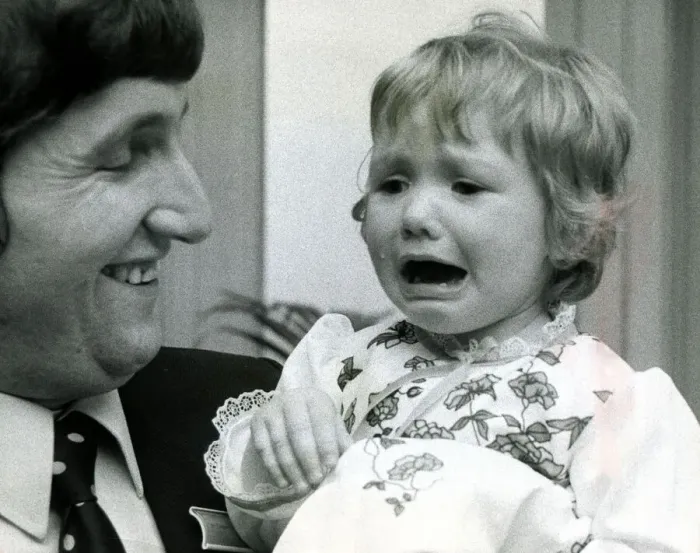 Framed Print : Eighteen month old Clare Timewall held by her father Chris crying her eyes out after Framed Print : Eighteen month old Clare Timewall held by her father Chris crying her eyes out after