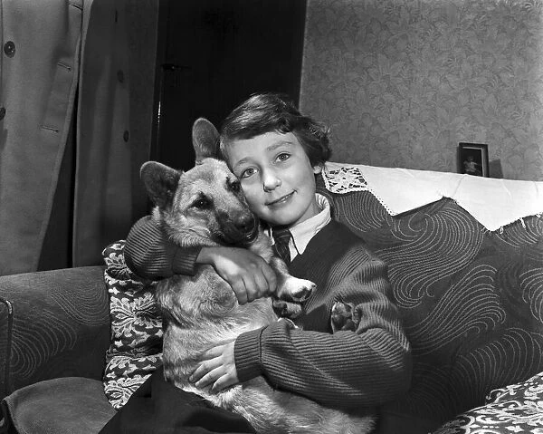 Elaine Cave, aged 9, with Mickey her pet Corgi, at home in Coalville, Leicestershire