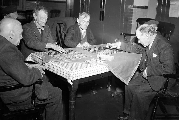 Elderly residents of a south coast nursing home seen here playing draughts. Circa 1952