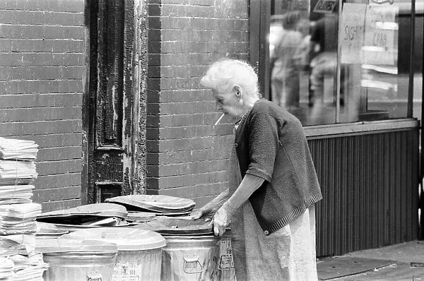 Elderly Woman putting out the trash, New York, USA, June 1984