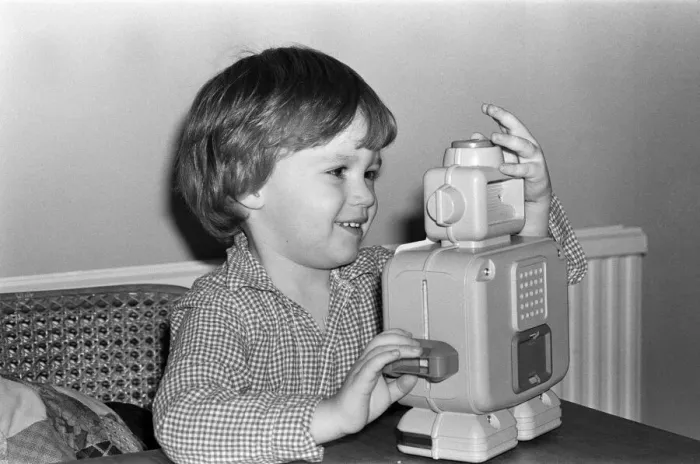 Framed Print : Electronic childrens toys. Pictured, 3 year old Matthew with an electronic robot Framed Print : Electronic childrens toys. Pictured, 3 year old Matthew with an electronic robot