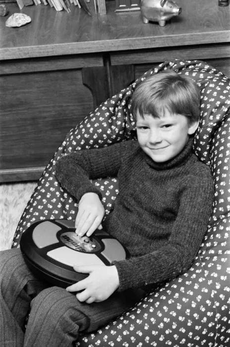 Framed Print : Electronic childrens toys. Pictured, 7 year old Simon with the Simon electronic Framed Print : Electronic childrens toys. Pictured, 7 year old Simon with the Simon electronic