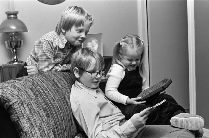 Framed Print : Electronic childrens toys. Pictured, children with a Merlin Electronic games machine Framed Print : Electronic childrens toys. Pictured, children with a Merlin Electronic games machine