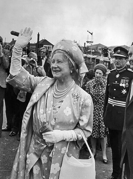 Elizabeth The Queen Mother waves to the cheering crowds at Shildon