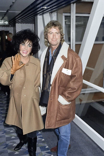 Elizabeth Taylor actress with her husband Larry Fortensky arriving at Heathrow airport