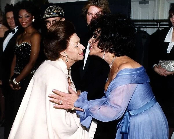 Elizabeth Taylor Actress kisses Princess Margaret as she arrives for a charity Gala in