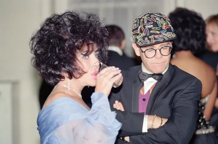 Framed Print : Elizabeth Taylor and Elton John at a gala dinner in aid of the AIDS Crisis Trust in Framed Print : Elizabeth Taylor and Elton John at a gala dinner in aid of the AIDS Crisis Trust in