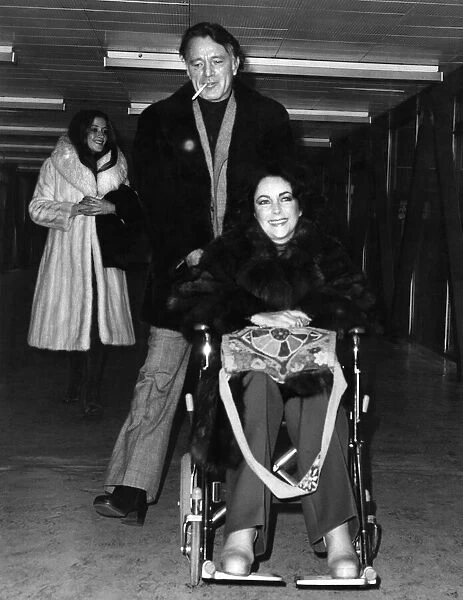 Elizabeth Taylor and Richard Burton Pictured at Heathrow Airport. December 1975