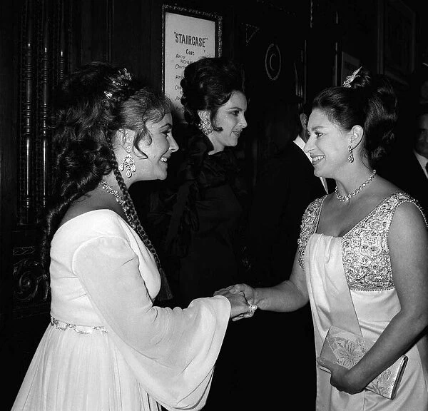 Elizabeth Taylor shaking hands with Princess Margaret at premiere of