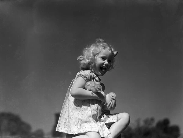 Ella Edwards with some baby chicks. 1940