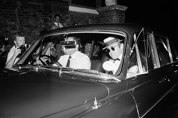 Elton John arriving at Prince Andrews stag party. 15th July 1986