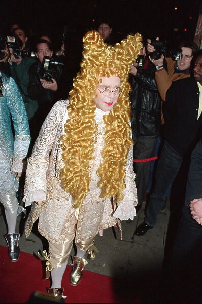Elton John attends his 47th birthday party. 26th March 1994