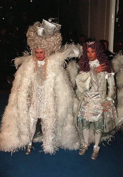 Elton John celebrates his 50th birthday at the Palais April 1997 dressed as Louis X1111
