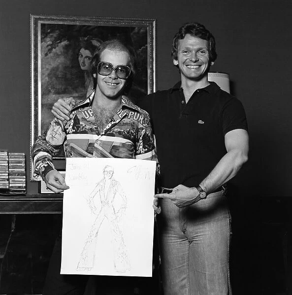Elton John with designer Bob Mackie. 20th June 1975