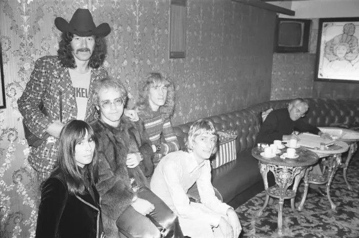 Framed Print : Elton John and his group pose for pictures in the Palladium bar during rehearsals for Framed Print : Elton John and his group pose for pictures in the Palladium bar during rehearsals for