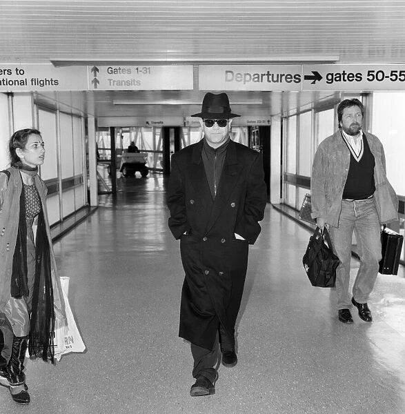 Elton John at Heathrow Airport, London. 26th August 1987