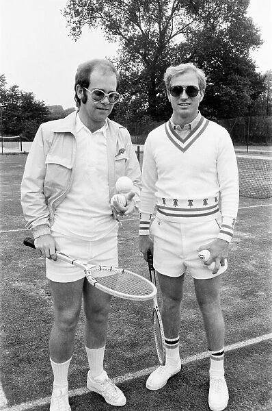 Elton John with Larry King (husband of Billie-Jean King) at Wimbledon playing tennis