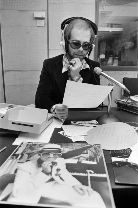 Framed Print : Elton John makes a whistle-stop visit to Birmingham and spends an hour as a disc jockey Framed Print : Elton John makes a whistle-stop visit to Birmingham and spends an hour as a disc jockey