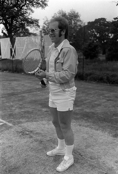 Elton John March 1974, playing tennis at Wimbledon 1974