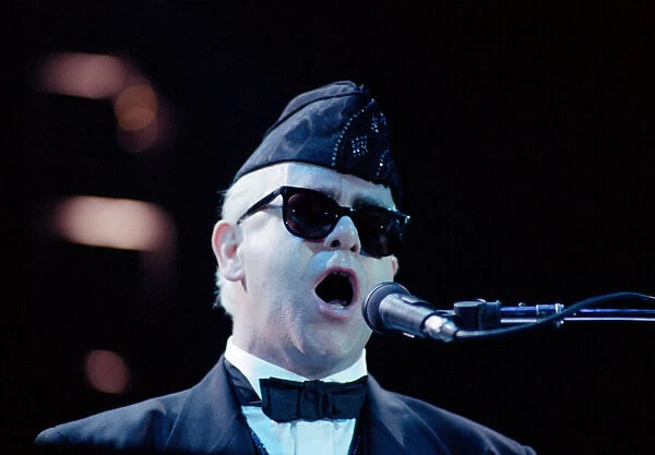 Elton John performing in concert in Paris during his Reg Strikes Back Tour