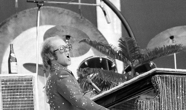 Elton John performing on stage at Wembley Stadium. London, England