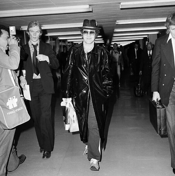Elton John pictured arriving at Heathrow Airport from Paris