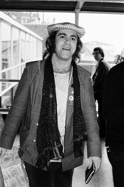 Elton John, pictured at Heathrow Airport, after his eight trail-blazing concerts in