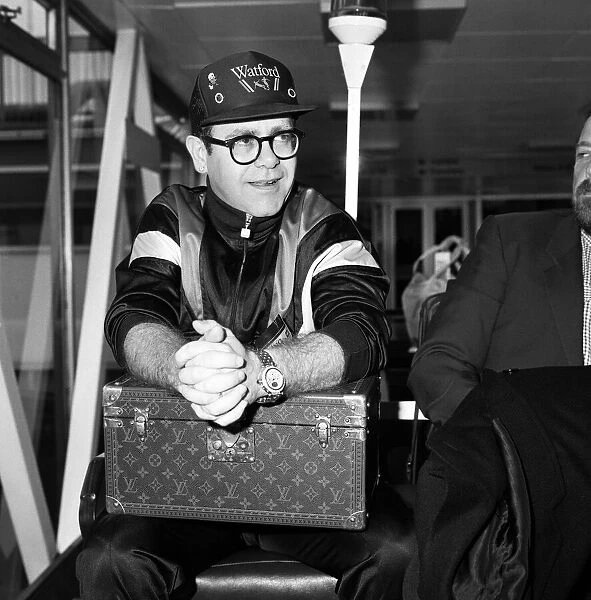 Elton John pictured at London Airport. 19th June 1987