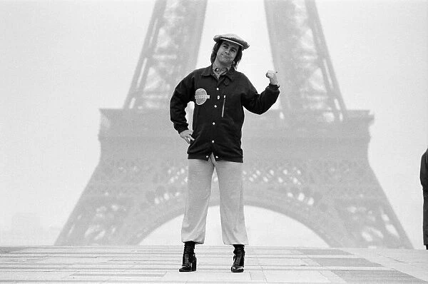 Elton John pictured in Paris in front of the Eiffel Tower