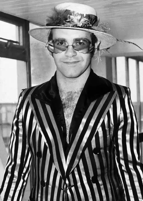 Framed Print : Elton John Pop singer pases through Heathrow Airport on his way back from Los Angeles
