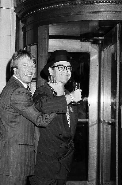 Elton John presents Watford FCs new manager, Dave Bassett, at a London reception