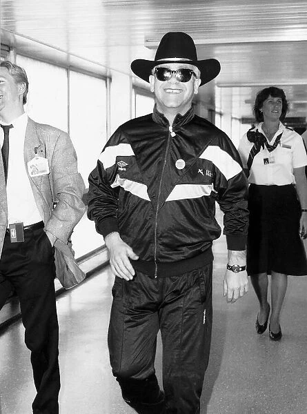 Elton john the singer arriving at Heathrow airport after the latest tour