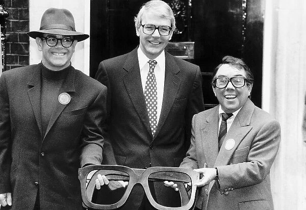 Elton John singer John Major and Ronnie Corbett help launch an appeal for old specs to be